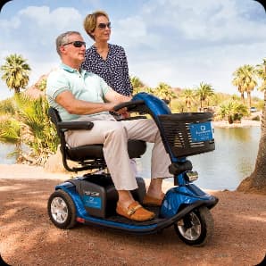 Couple using a Standard Electric Scooter outdoors